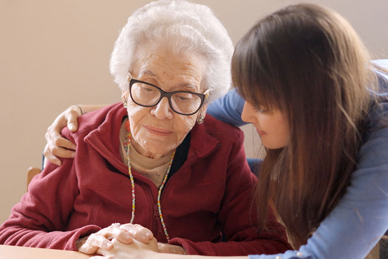 blog-4-1-2025 A young woman with her arm around an elderly woman